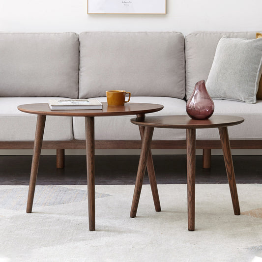 Pebble-shaped coffee table with walnut finish, mid-century modern style, limited edition by Anthony & Home, showing smooth rounded surface.