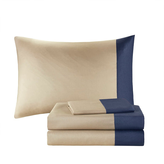 Navy Twin XL brushed microfiber comforter set by Anthony & Home with matching pillow shams on a bed.