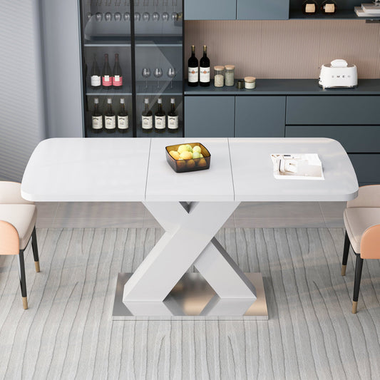 White MDF dining table with X-shaped steel base from Anthony & Home Studio Collection, modern and stylish in design.