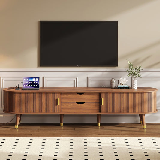 Walnut mid-century TV stand with sleek design and storage compartments, styled in a modern Anthony & Home Studio setting.