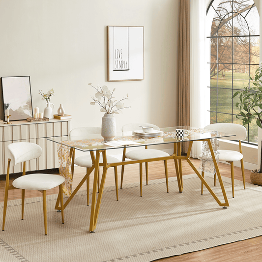 Rectangular glass dining table with gold finish from Anthony & Home's Atelier Collection, showcasing a sleek modern design.
