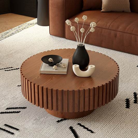 Round lacquered wood coffee table with pedestal base, sleek design by Anthony & Home for contemporary living spaces.