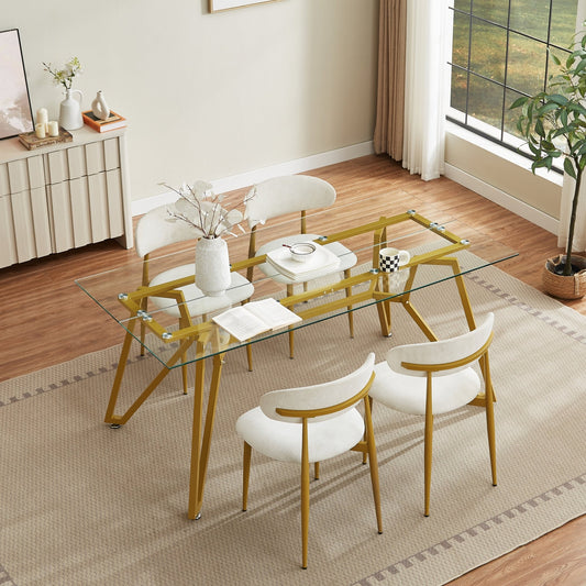Rectangular glass dining table with gold finish from Anthony & Home's Atelier Collection, showcasing a sleek modern design.