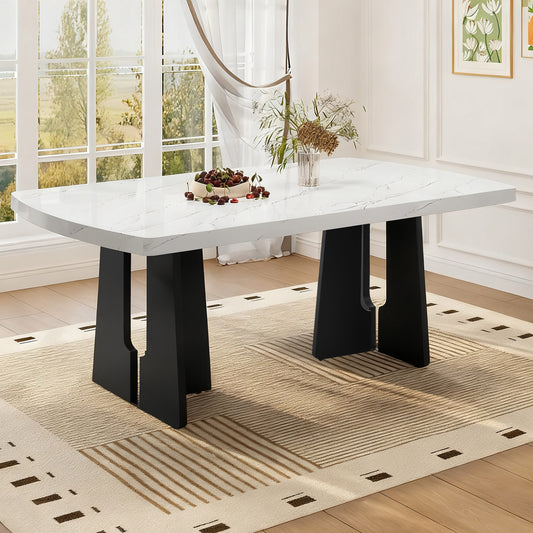 Black and white faux marble dining table with geometric legs by Anthony & Home, showcasing a modern, stylish design.
