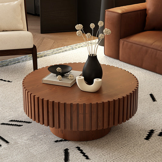 Round lacquered wood coffee table with pedestal base by Anthony & Home, showcasing smooth finish and elegant design.