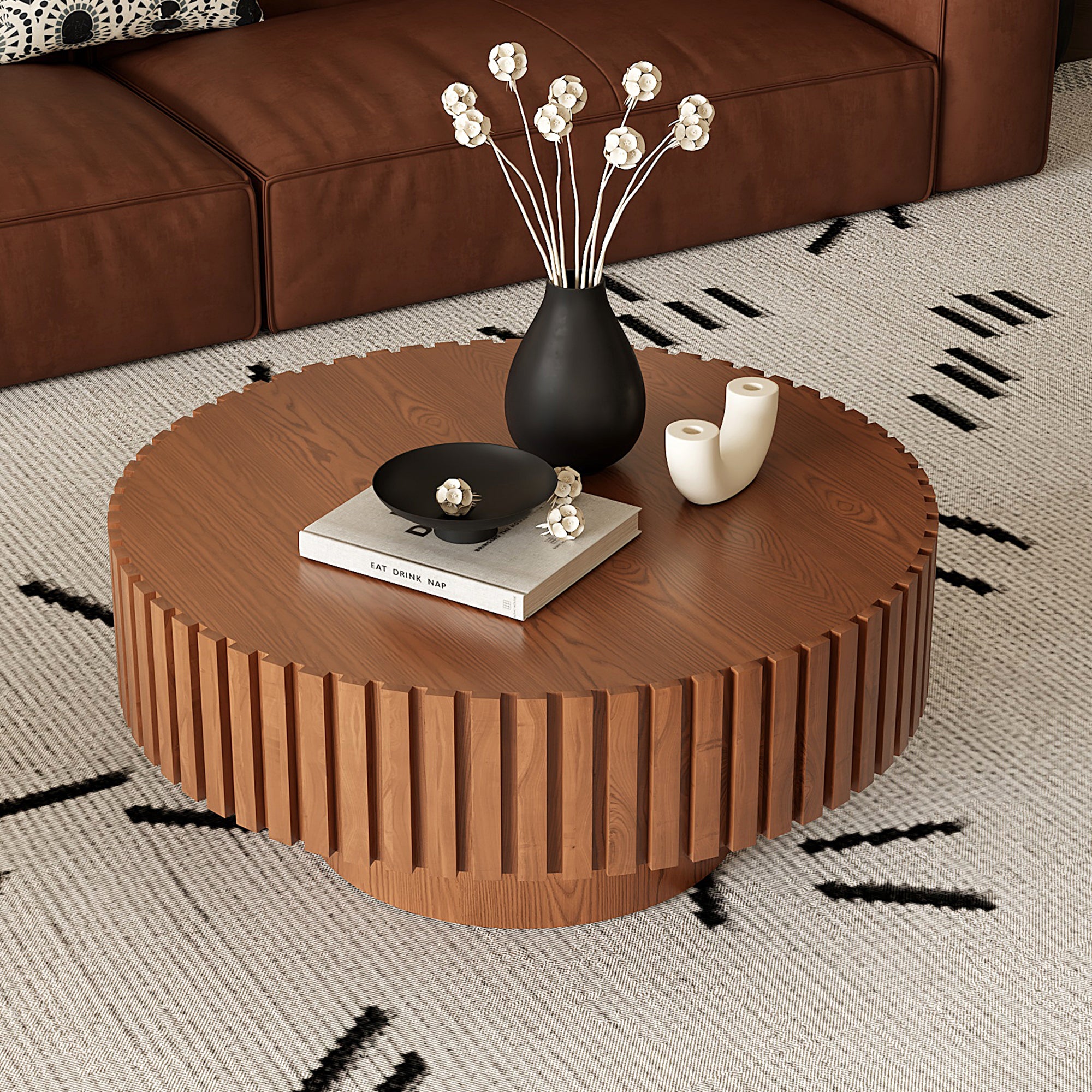 Round lacquered wood coffee table with pedestal base by Anthony & Home, showcasing a smooth, polished surface and elegant design.
