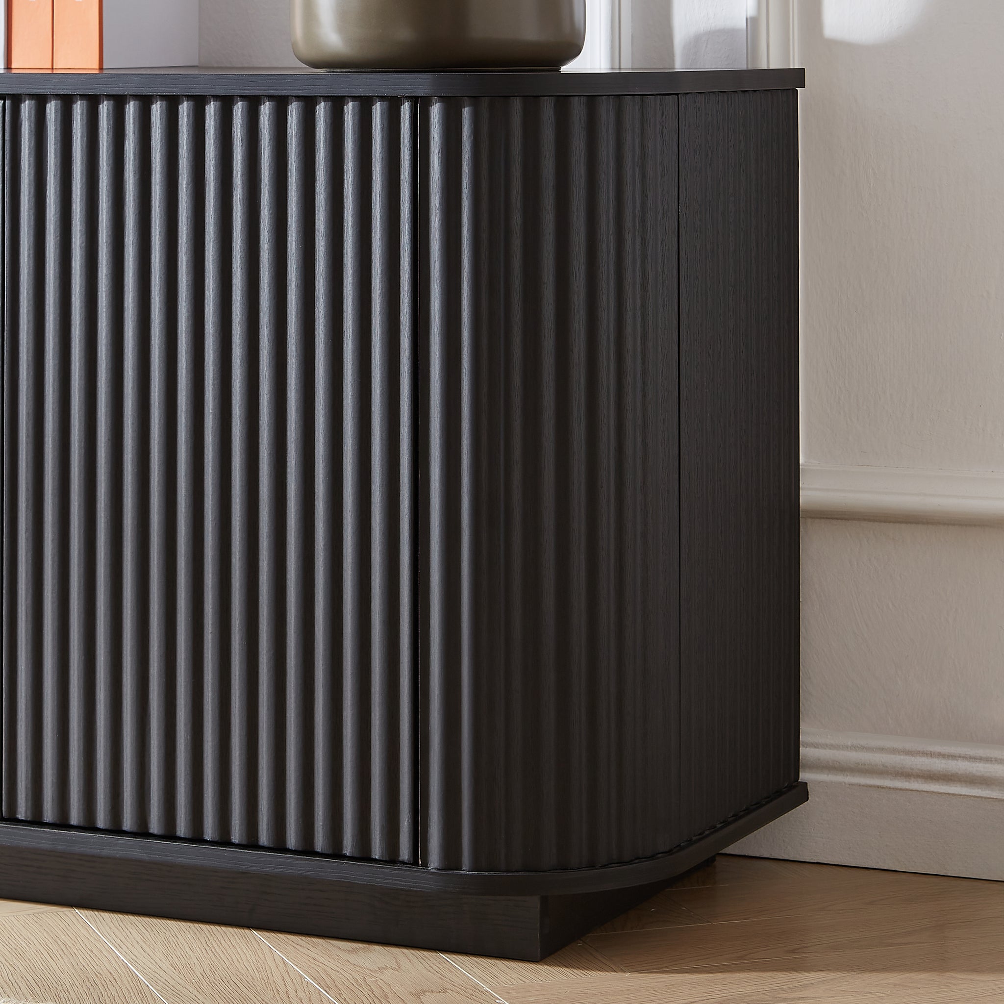 Black wood sideboard with a wave pattern design, perfect for TV stand or storage, by Anthony & Home.