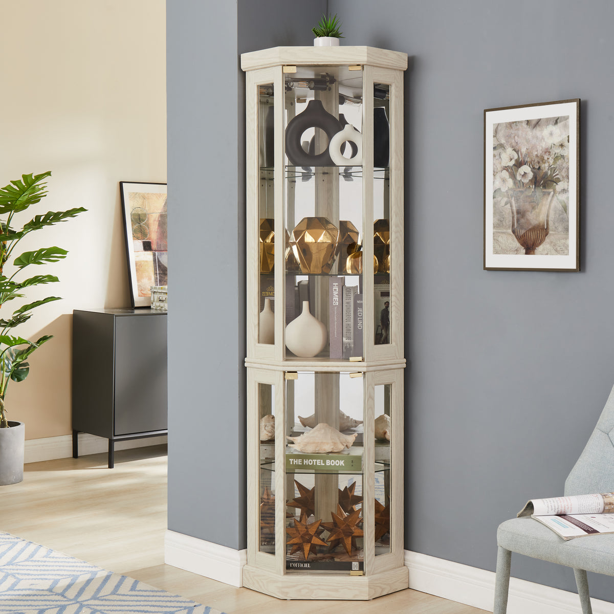 White lacquer lighted corner curio cabinet by Anthony & Home featuring glass doors and interior lighting.