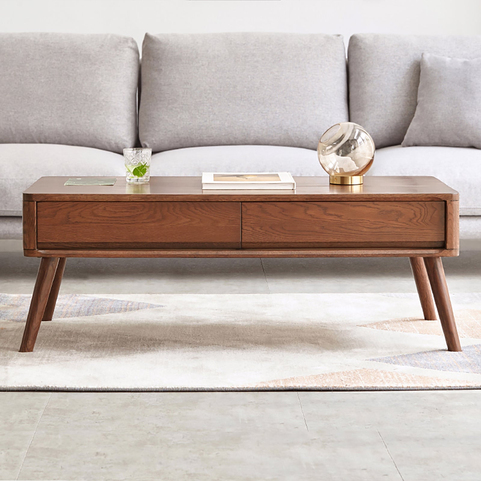 Solid oak center table with lift-top design and hidden storage shelf from Anthony & Home's Atelier Collection.