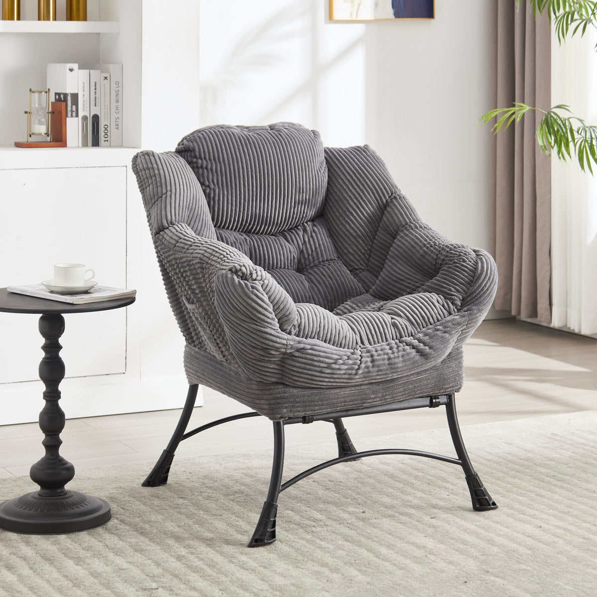 Grey upholstered lounge chair with matching ottoman and armrests, modern and comfortable seating from Anthony & Home.