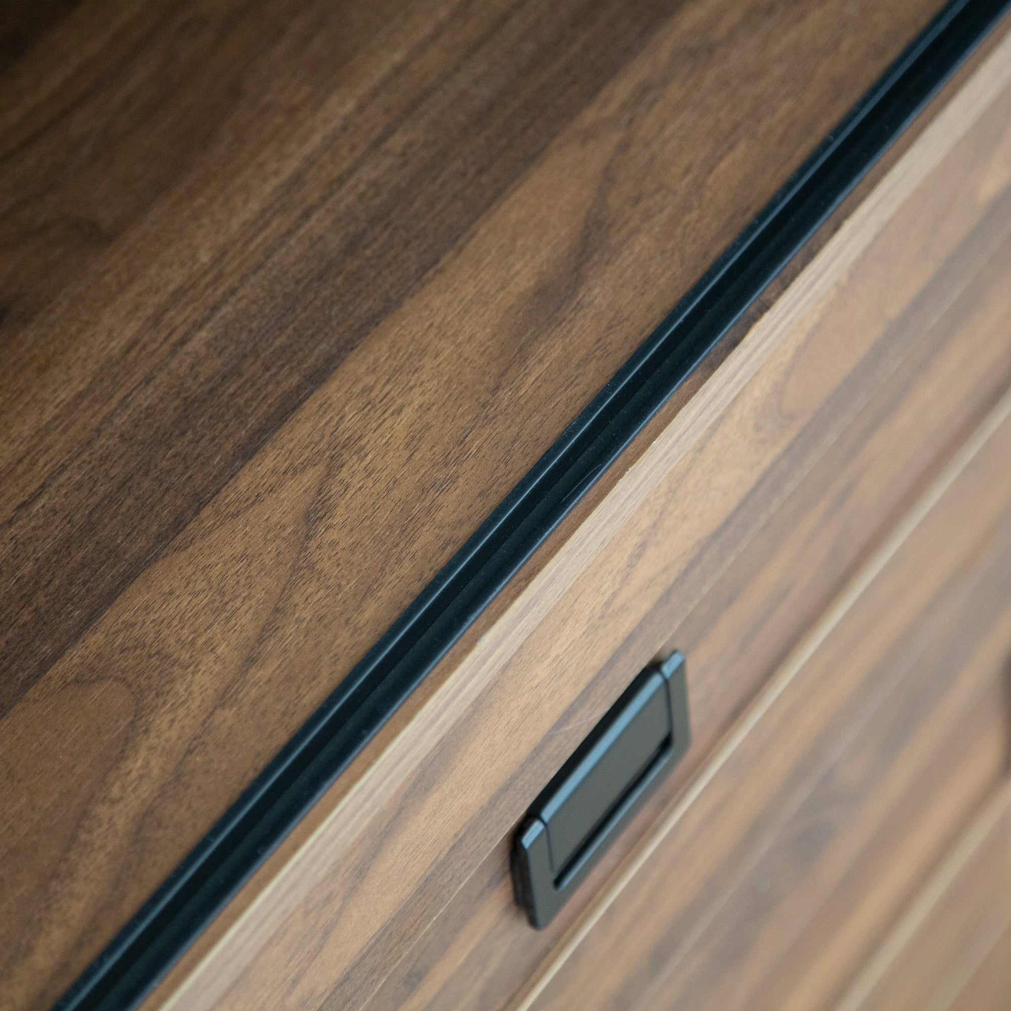 Anthony & Home Signature Collection tall bedroom armoire with double doors and sleek wooden finish, standing on a light-colored floor.