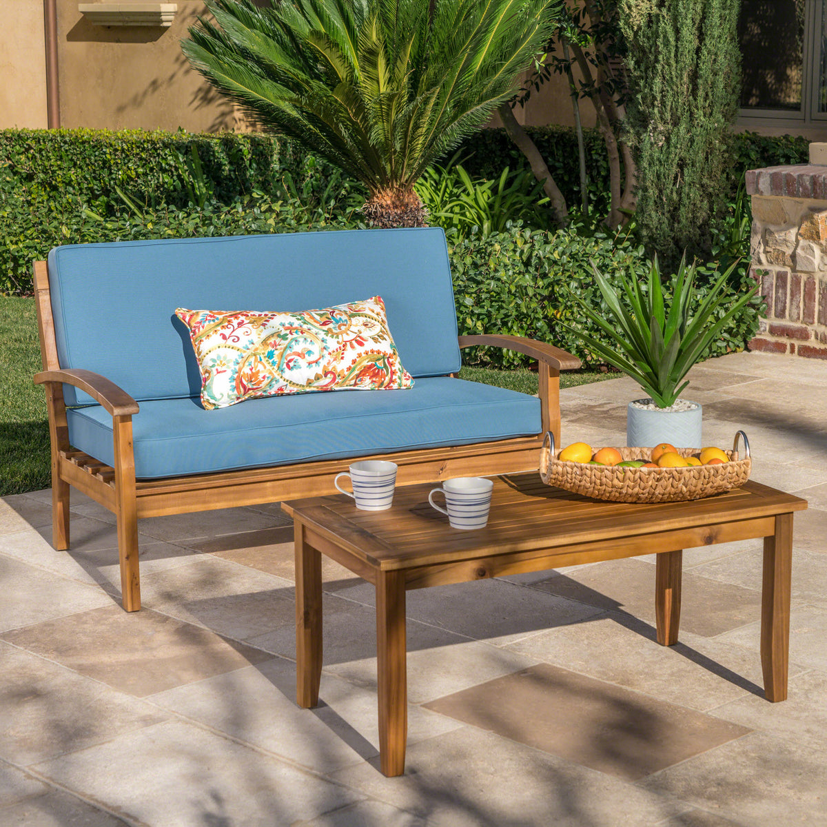 Anthony & Home teak outdoor chat set with loveseat and coffee table from the Atelier Collection, handcrafted teak finish.