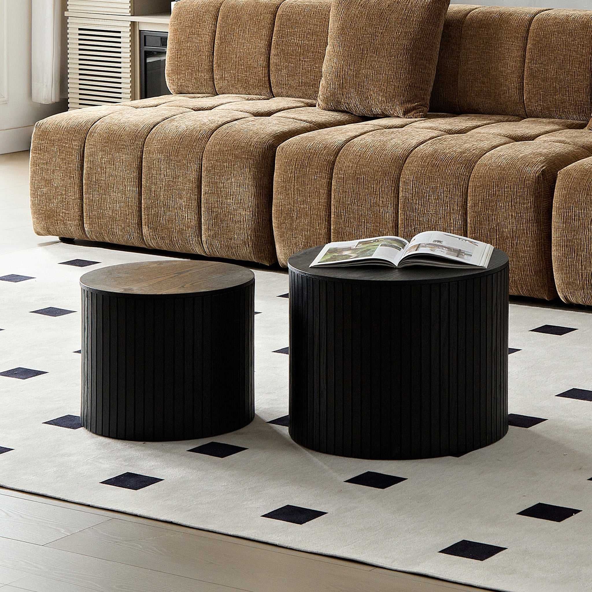 Pair of black walnut veneer nesting coffee tables by Anthony & Home, showcasing sleek, modern design with smooth surfaces and rounded edges.