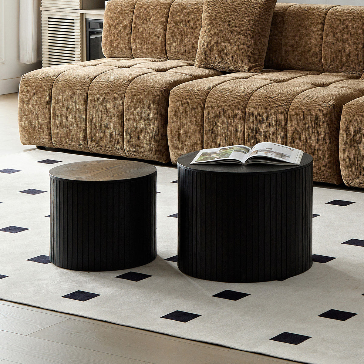 Pair of black walnut veneer nesting coffee tables by Anthony & Home, showcasing sleek, modern design with smooth surfaces and rounded edges.