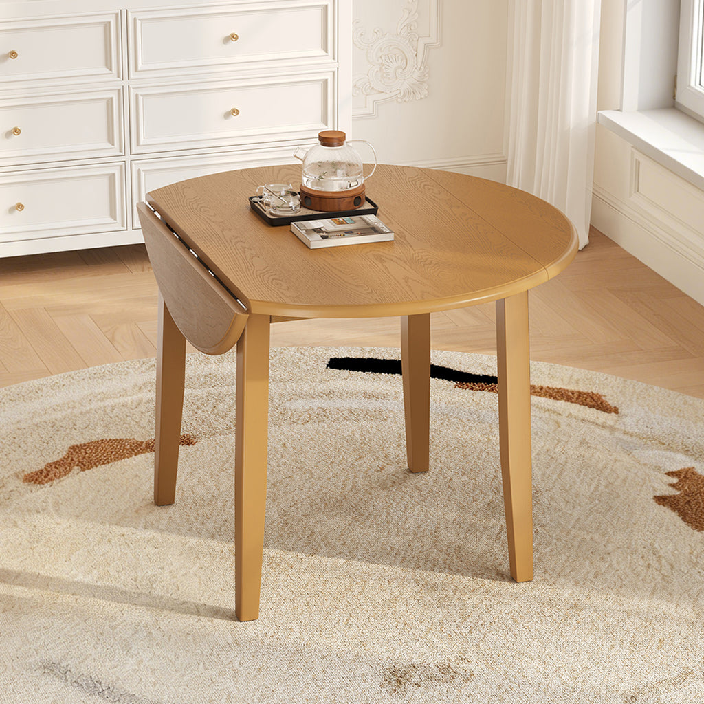Extendable round dining table made of solid wood by Anthony & Home, showing its polished surface and extendable feature.