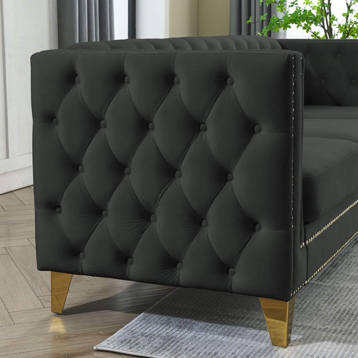 Black velvet 3-seater tufted sofa with metal legs by Anthony & Home, showcasing plush upholstery and modern design.