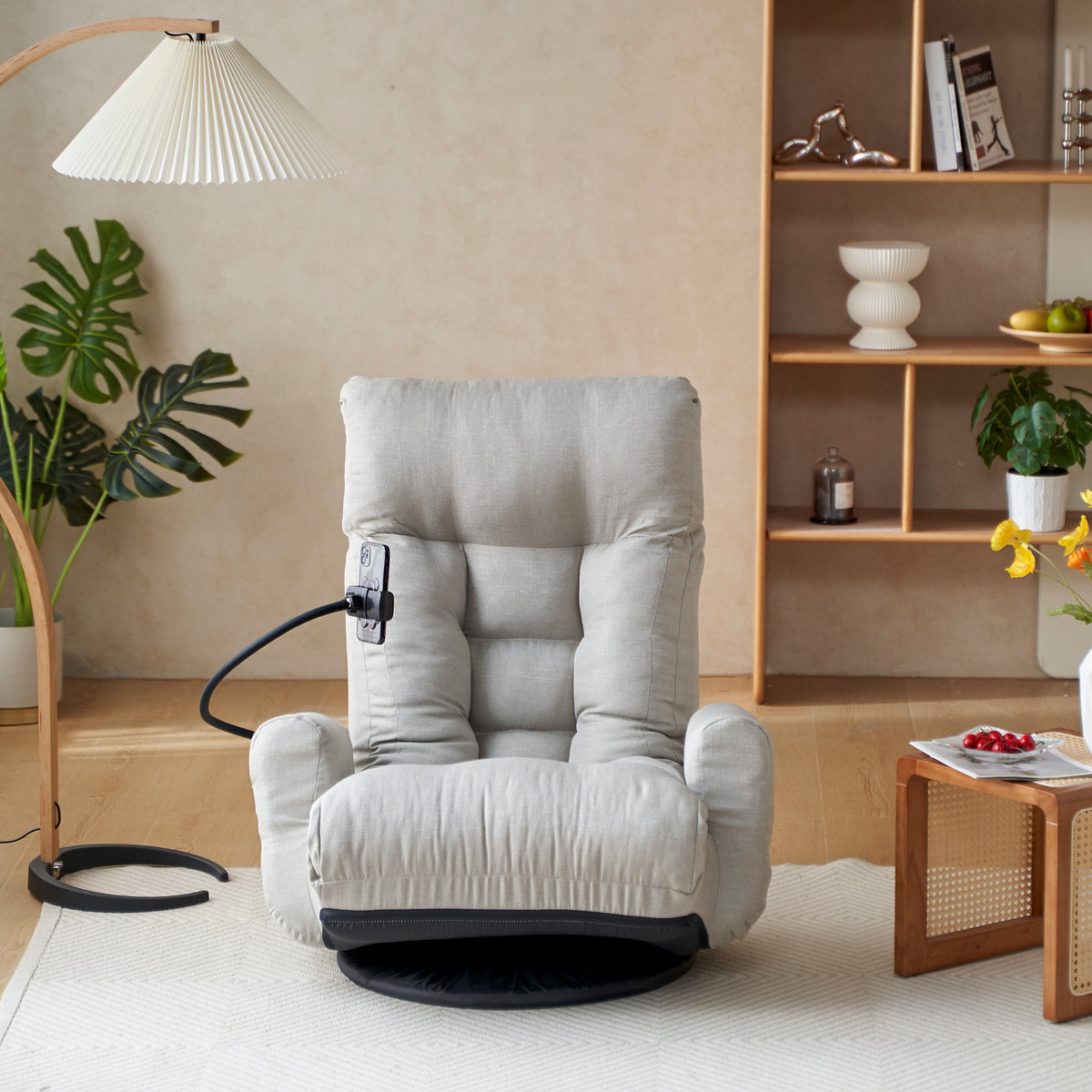 Gray Anthony & Home swivel lounge chair with 360-degree rotation, featuring a plush cushioned seat and modern design.