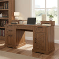 Anthony & Home Atelier dark walnut farmhouse office desk with barn door, monitor stand, and built-in charging station.