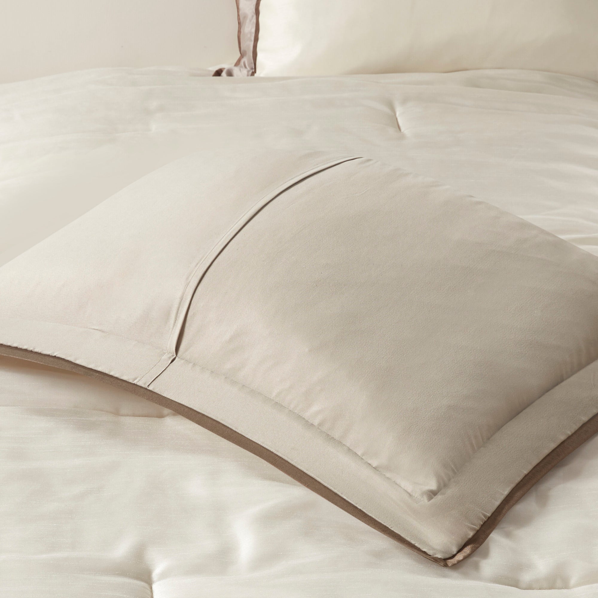 Genevieve Polyoni taupe king comforter set by Anthony & Home with plush fabric and decorative pillows on a bed.