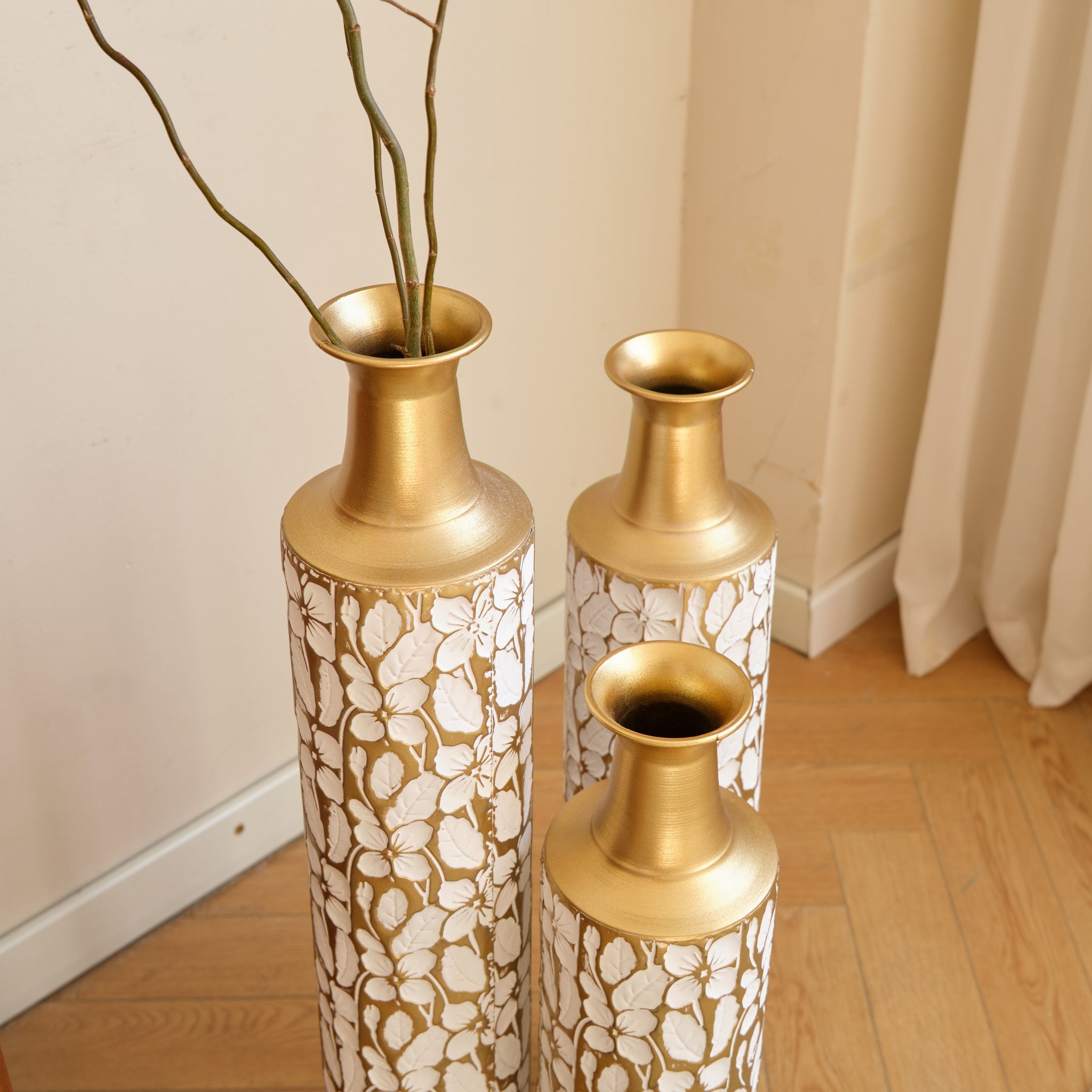 Heritage Collection floor vase trio by Anthony & Home, featuring three elegant ceramic vases with intricate patterns and a tall, modern design.