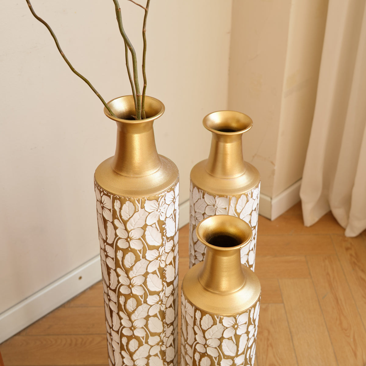 Heritage Collection floor vase trio by Anthony & Home, featuring three elegant ceramic vases with intricate patterns and a tall, modern design.