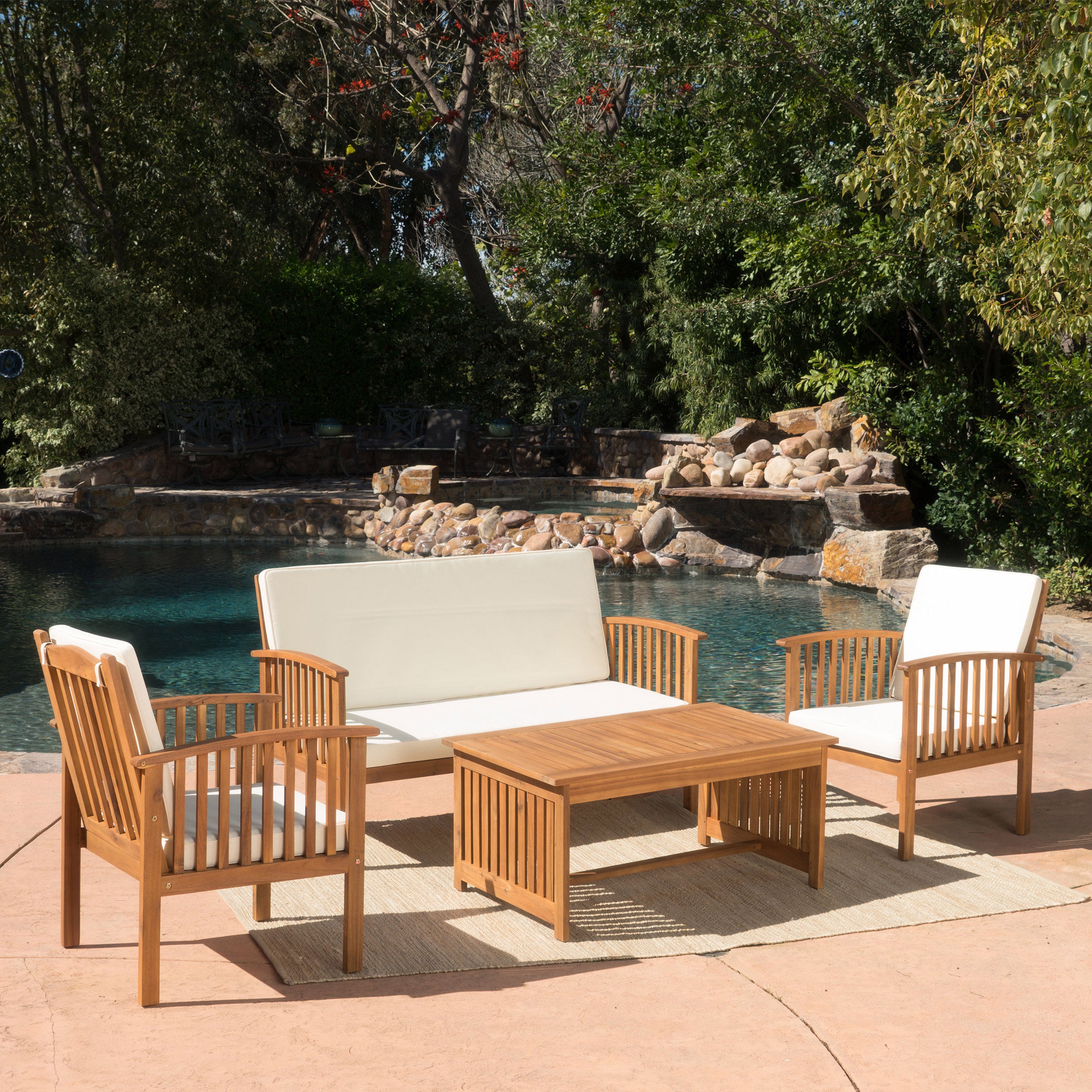 Acacia wood outdoor chat set with water-resistant cushions, featuring a rectangular table and comfortable seating for outdoor lounging.