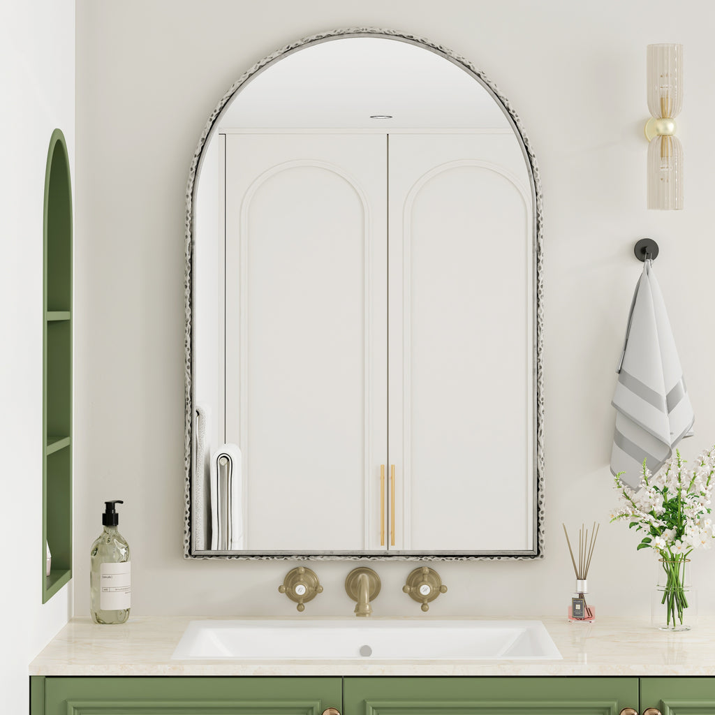 Arched silver mirror with tempered glass frame by Anthony & Home, showcasing a sleek, modern design with reflective surface.