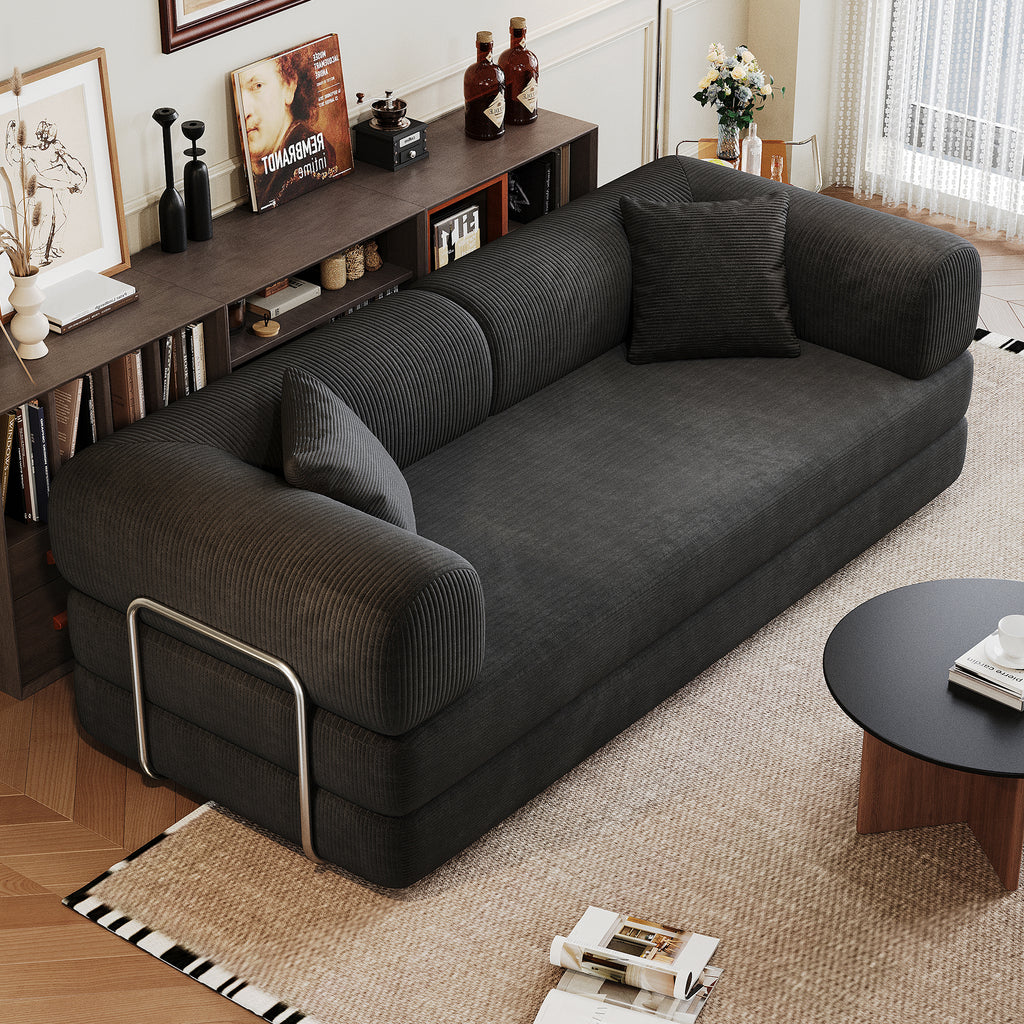 Black corduroy convertible sofa bed from Anthony & Home's Atelier Collection, showcasing its plush fabric and versatile design.