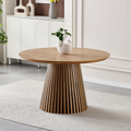 Round solid wood dining table from Anthony & Home Atelier Collection, showcasing smooth wood surface and sturdy legs.