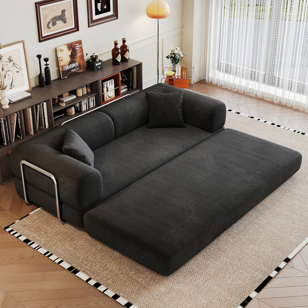 Black corduroy convertible sofa bed from Anthony & Home's Atelier Collection, showing its sofa and bed configurations.