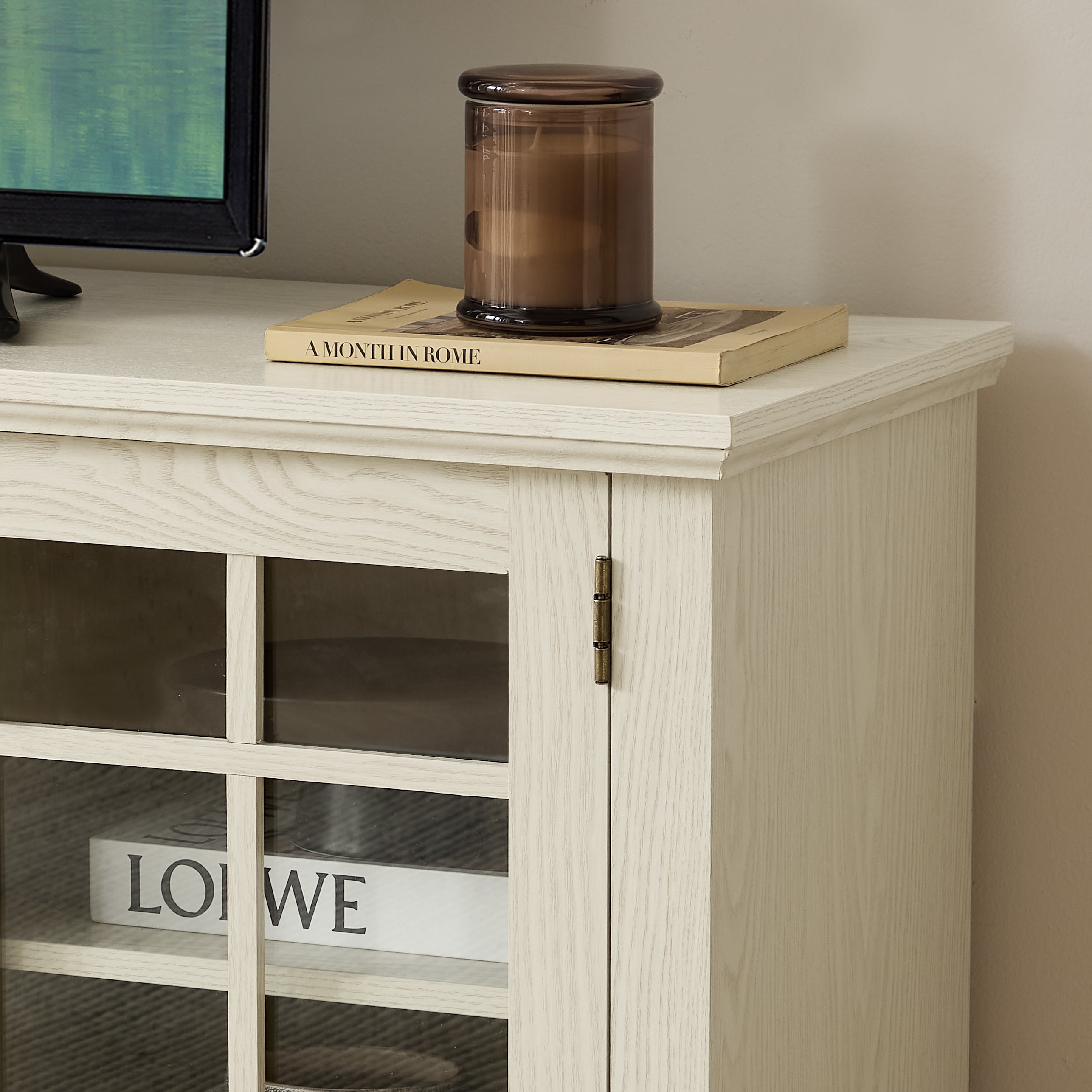 Anthony & Home Atelier white faux stone TV stand, 70-inch with two doors, modern living room furniture piece.