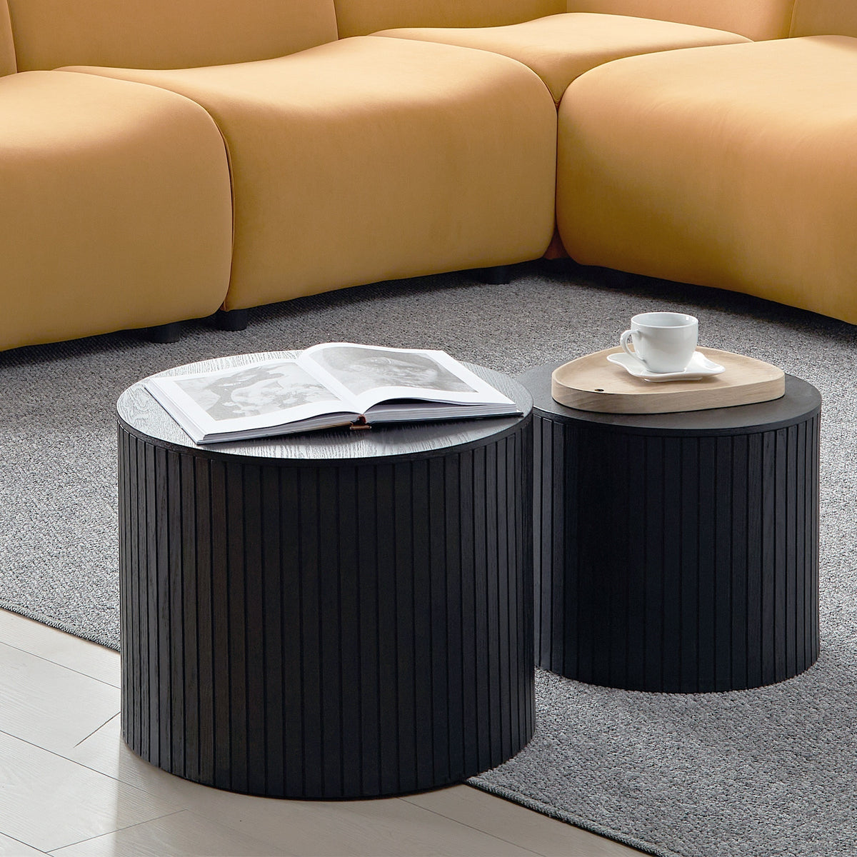 Two black walnut veneer nesting coffee tables by Anthony & Home, showcasing sleek modern design and smooth wooden surfaces.