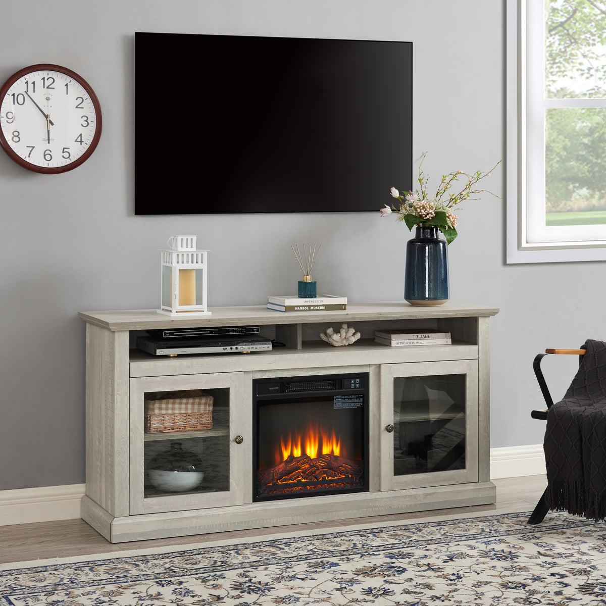 Stone gray finish Studio TV media console with fireplace from Anthony & Home, featuring sleek design and built-in fire feature.