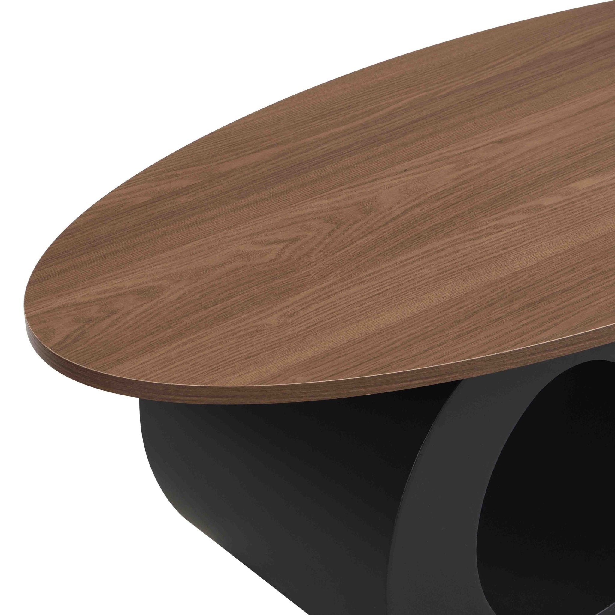 Set of two black MDF nesting coffee tables with metal bases by Anthony & Home, featuring sleek modern design and layered surfaces.