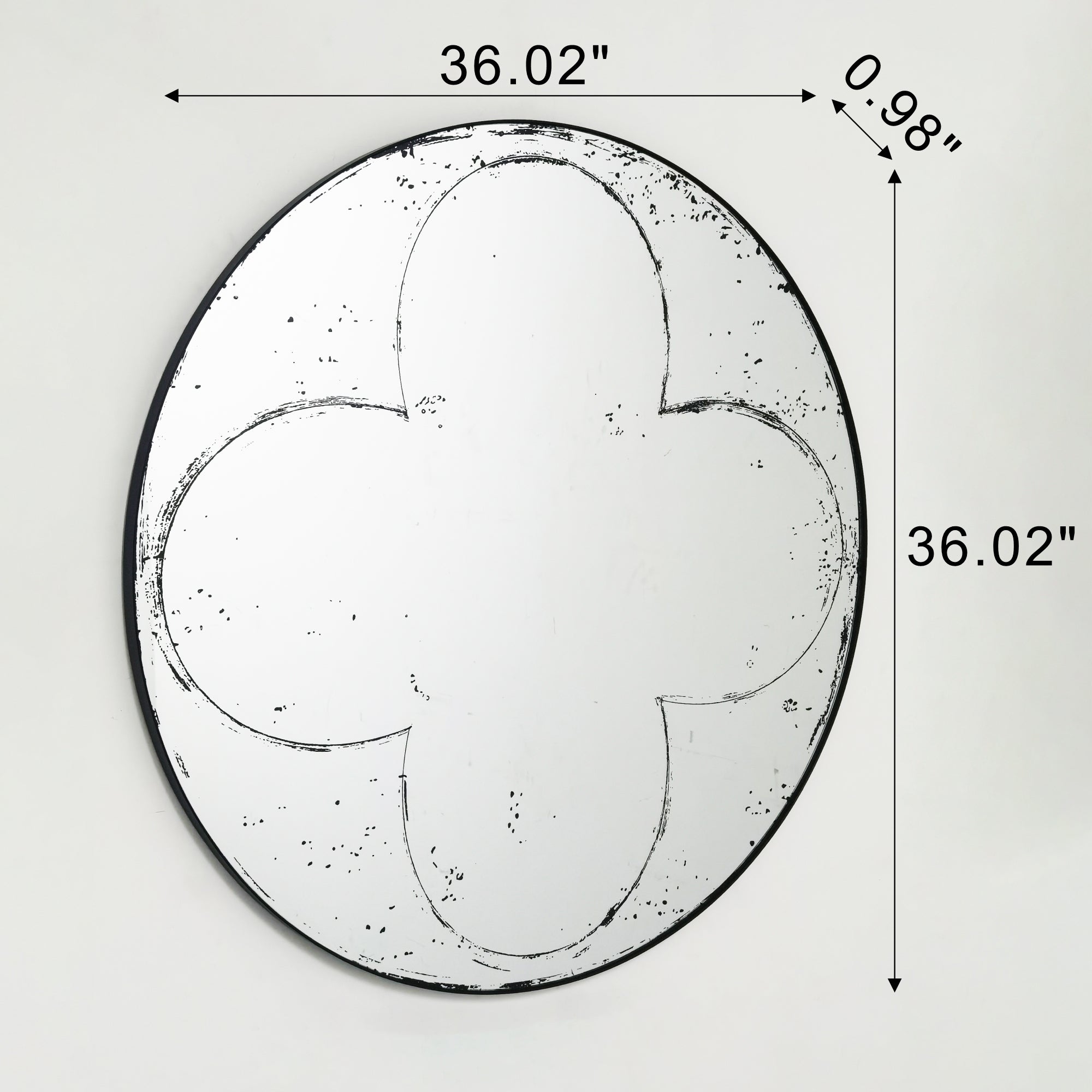 Round wall mirror with brushed brass frame by Anthony & Home, reflecting a modern, stylish interior design element.