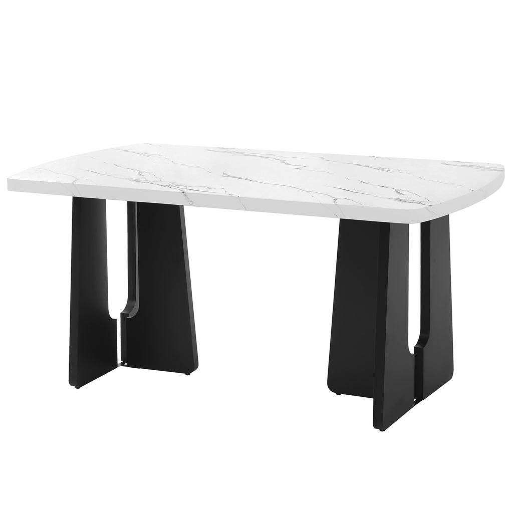Black and white faux marble dining table with geometric legs by Anthony & Home, showcasing a modern, stylish design.