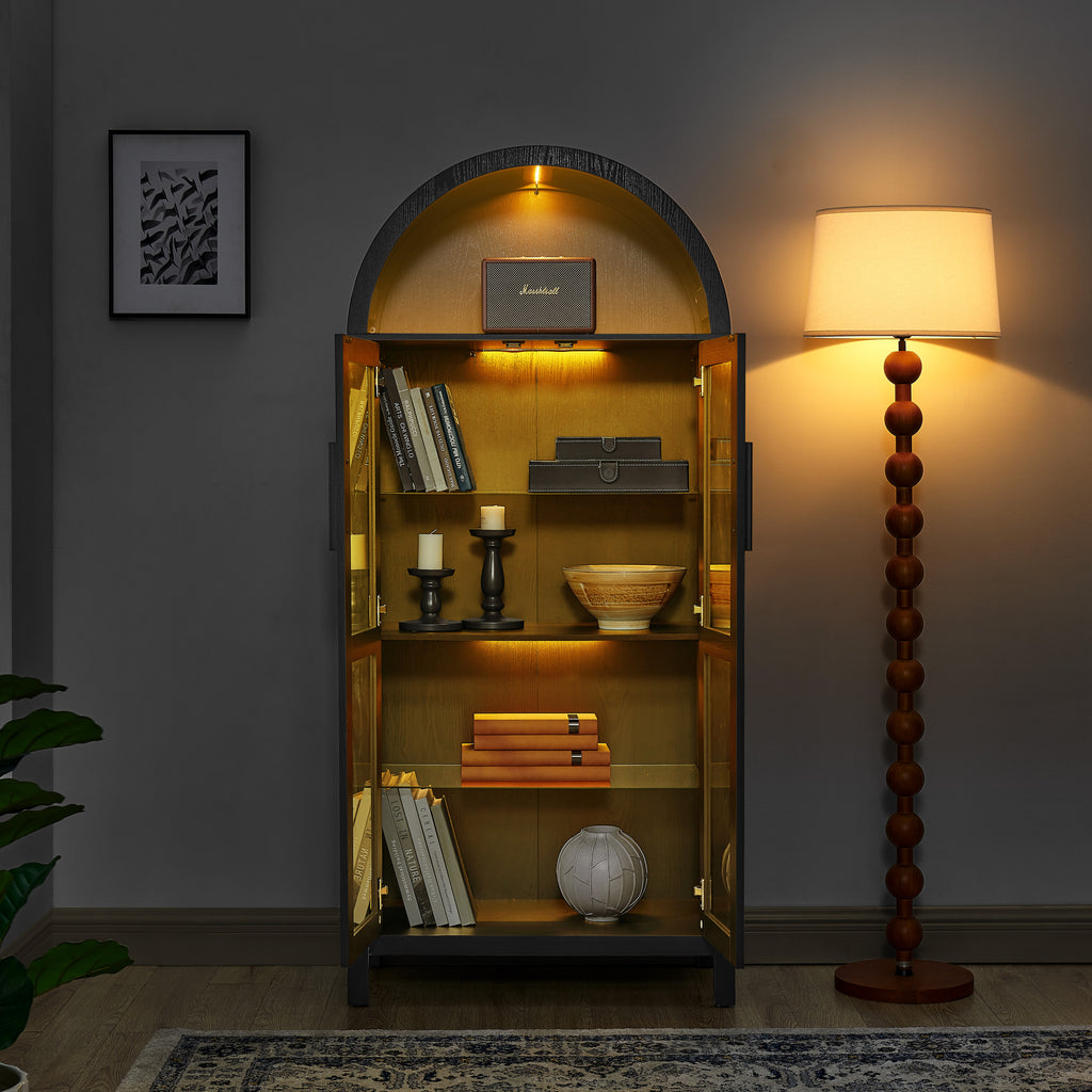 Black arched lamp cabinet with glass partition, designed by Anthony & Home, featuring an elegant atelier style.
