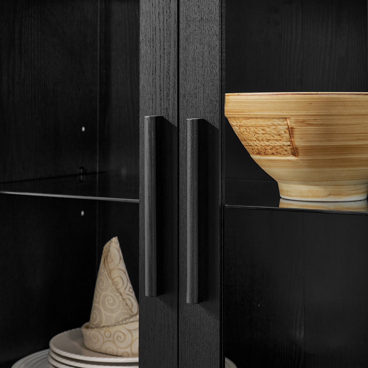 Black arched lamp cabinet with glass partition in an atelier style by Anthony & Home, showcasing a stylish interior accent piece.