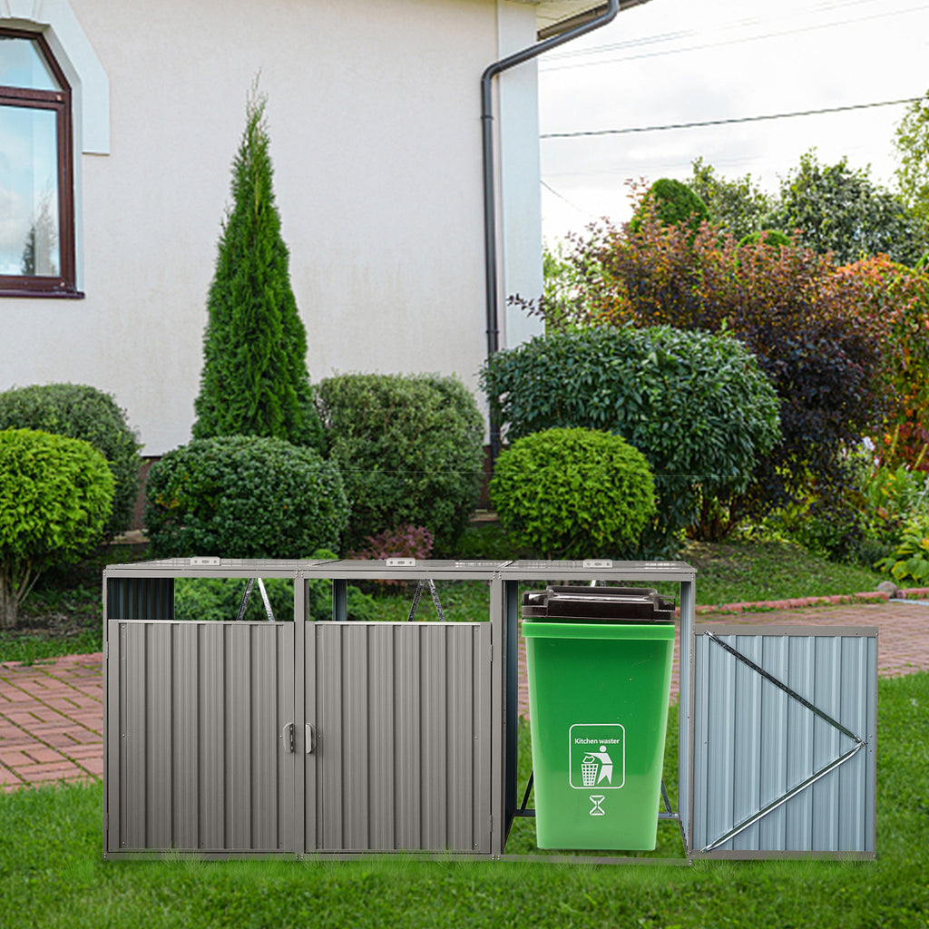 Grey galvanized steel trash bin shed by Anthony & Home with three can compartments for outdoor waste storage.