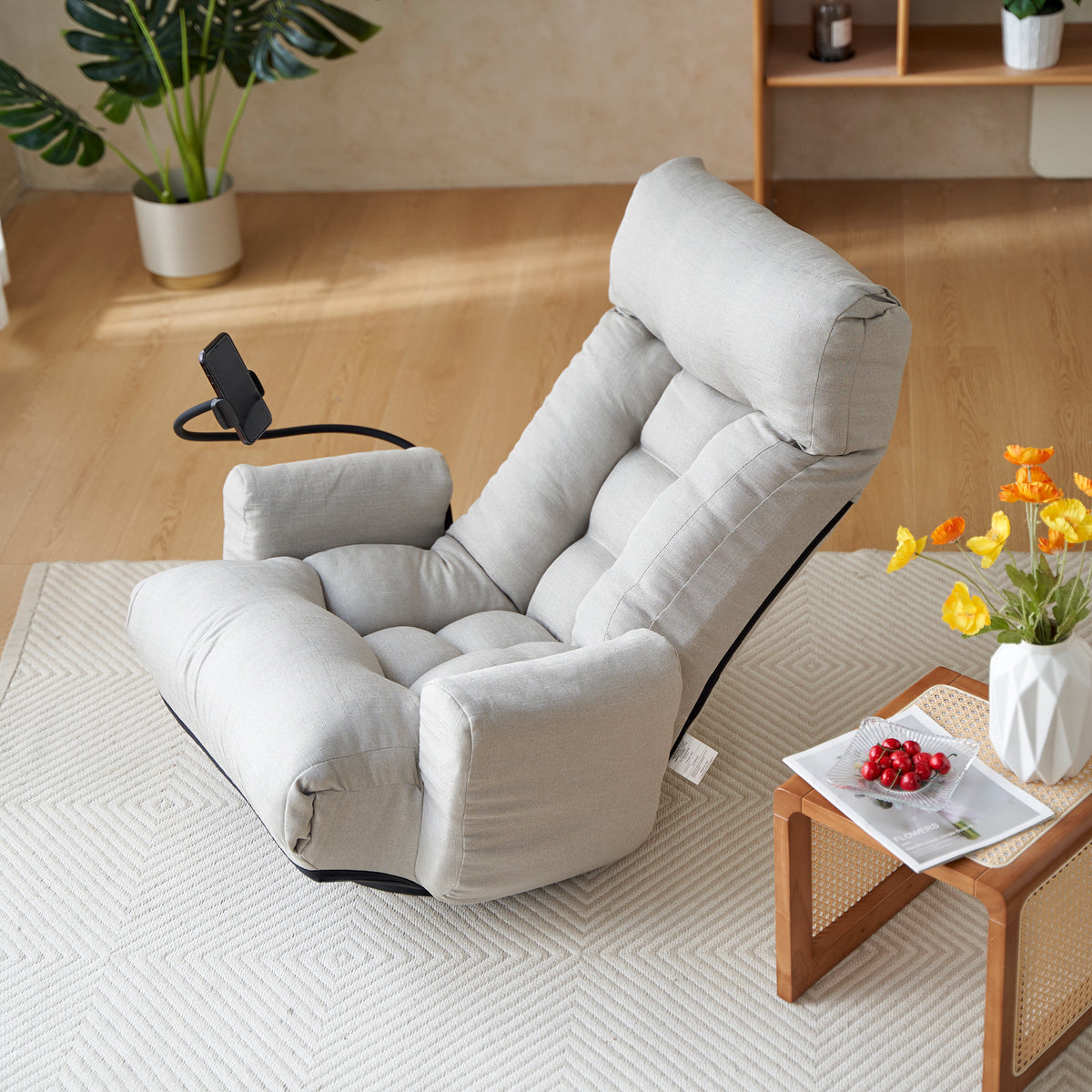 Gray Anthony & Home swivel lounge chair with 360-degree rotation, featuring a modern design and cushioned seat for comfort.