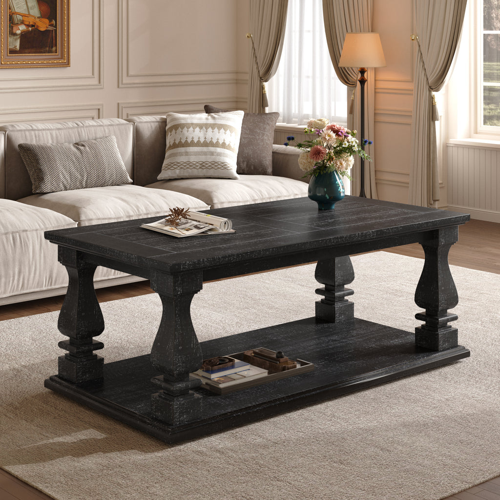 Weathered black farmhouse coffee table with heavy plank top, baluster legs, and storage shelf from Anthony & Home's Atelier Collection.