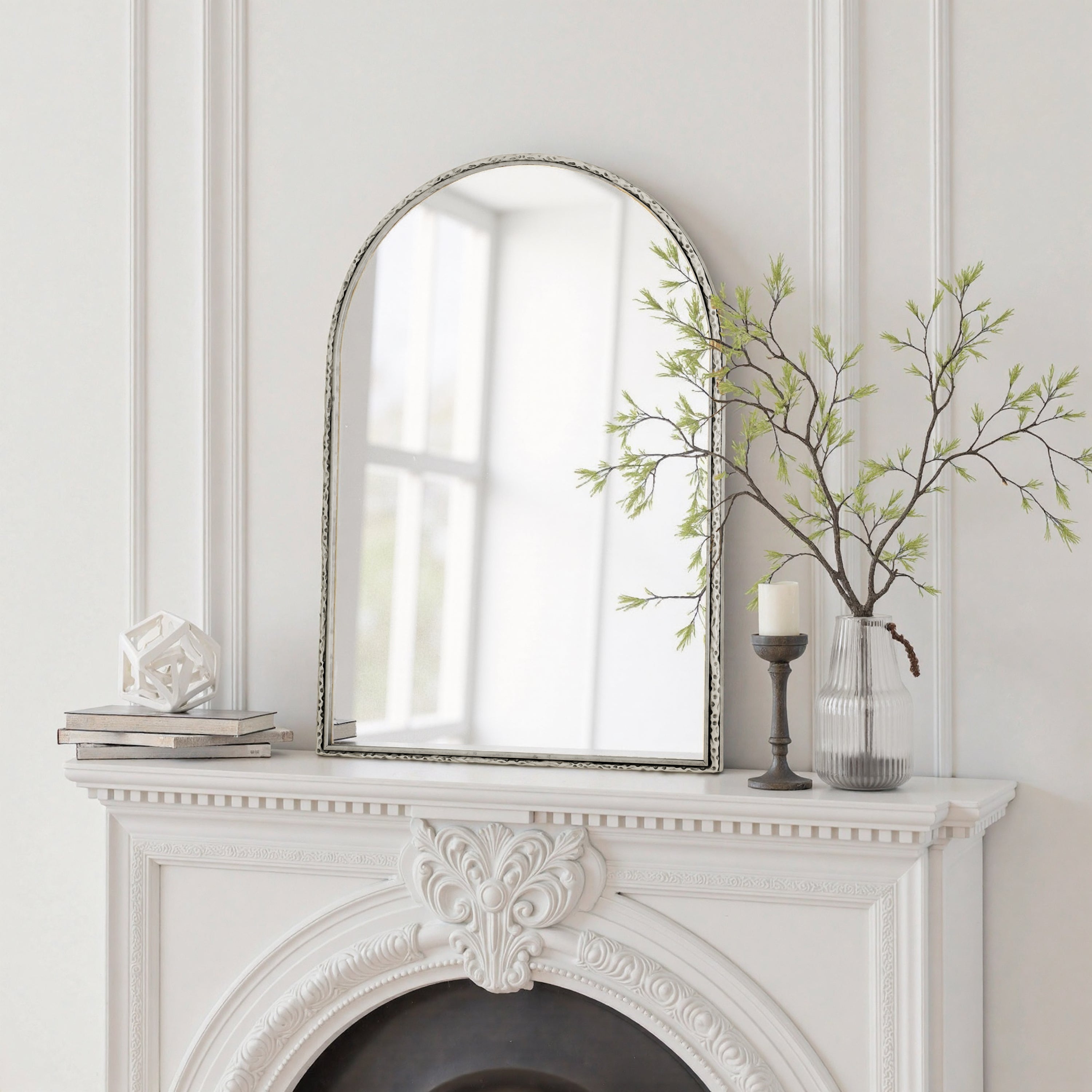 Arched silver mirror with tempered glass frame by Anthony & Home, showcasing a sleek, modern design with reflective surface.