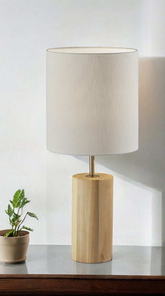 Natural wood circular block table lamp by HomeRoots with a smooth wooden base and simple design, ideal for cozy home lighting.