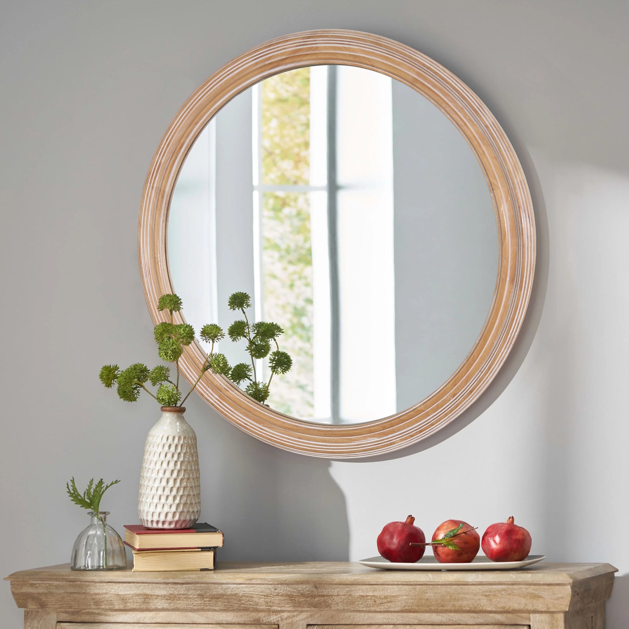 Round wall mirror with whitewash wood frame from Anthony & Home, showcasing a stylish, rustic design for modern interiors.