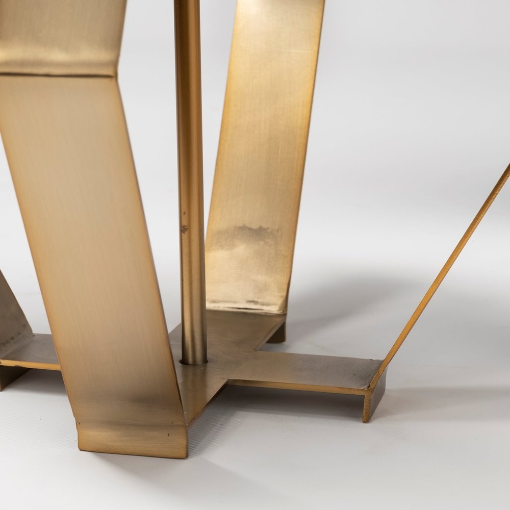 Gold geometric design table lamp by HomeRoots, featuring a modern style with a sleek metal base and geometric pattern.