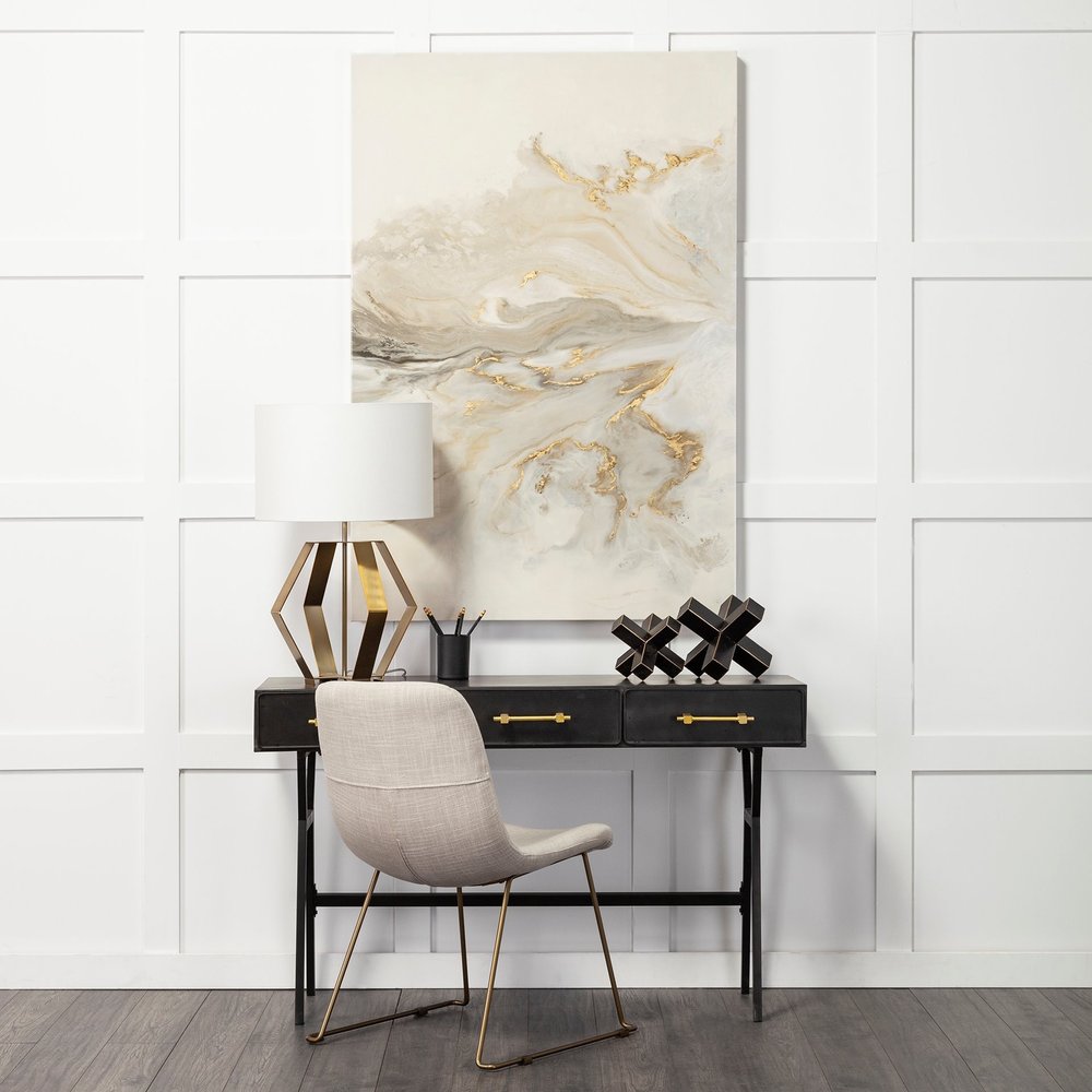 Gold geometric design table lamp with a modern base and shade, perfect for stylish home or office decor.