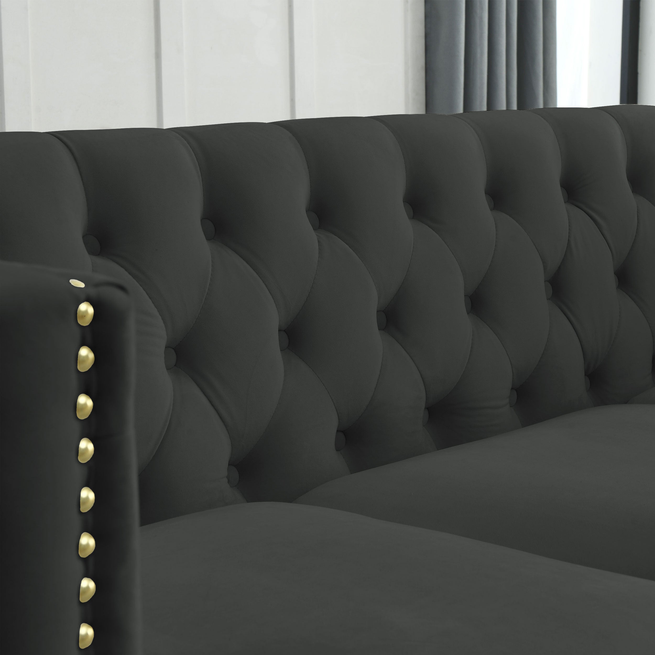Modern black velvet 3-seater sofa with button tufting, metal legs, soft upholstery, and solid wood frame by Anthony & Home.