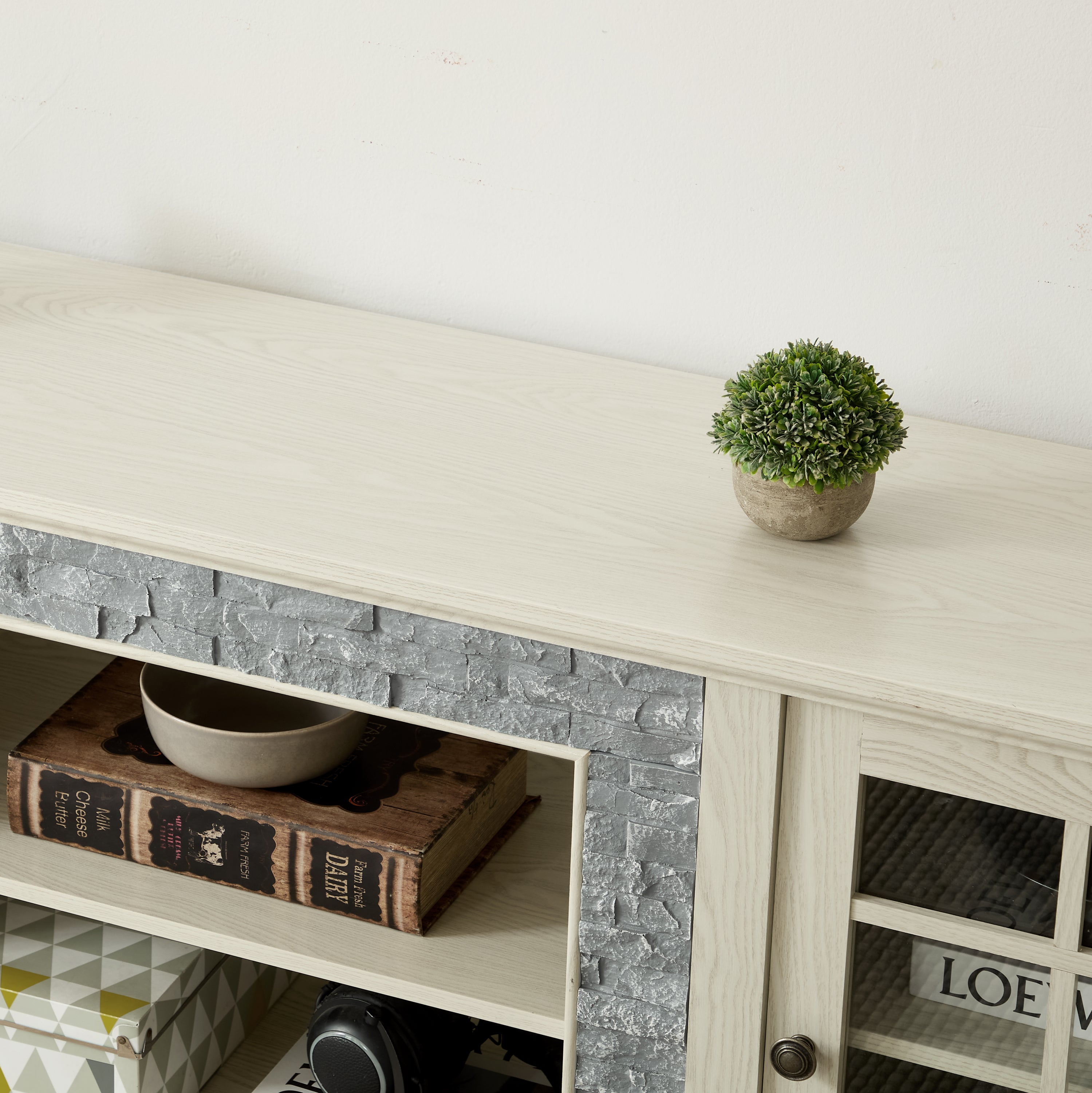 Anthony & Home Atelier white faux stone TV stand, 70-inch with two doors, modern design, showcasing sleek surface and sturdy build.