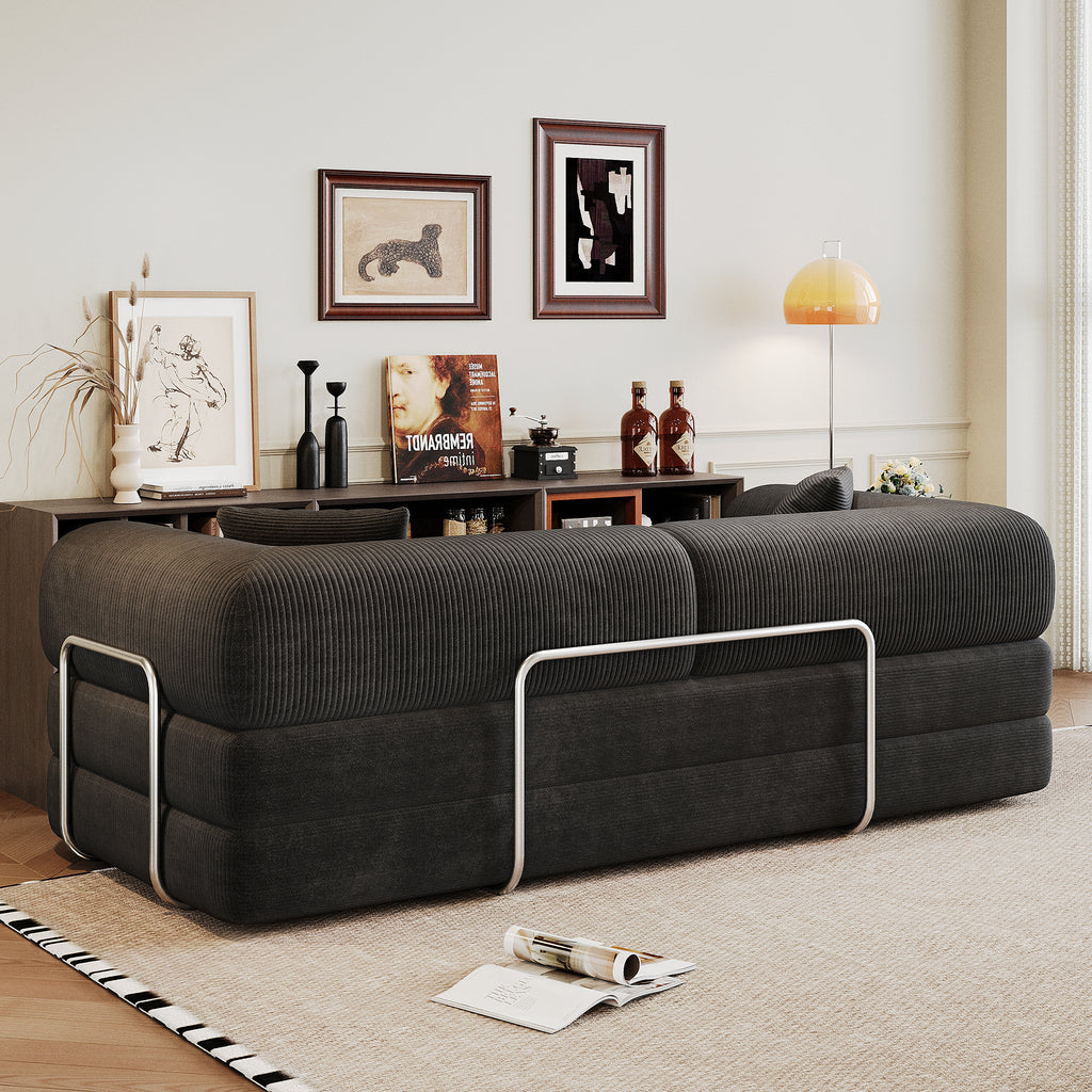 Black corduroy convertible sofa bed from Anthony & Home's Atelier Collection, showing the sofa in its seated and bed configurations.