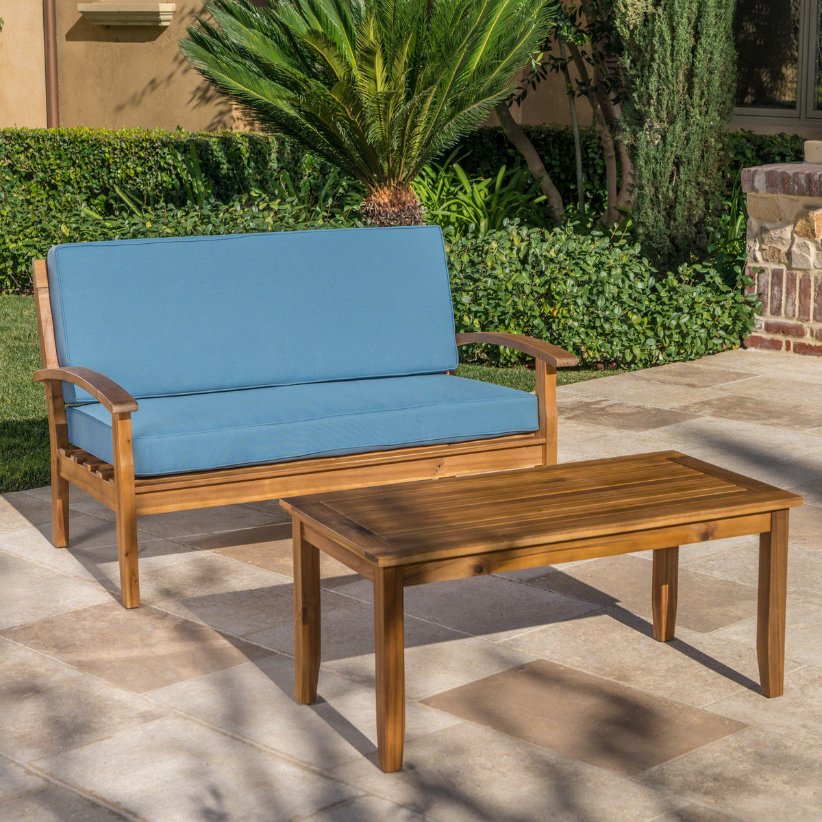 Anthony & Home teak outdoor chat set with loveseat and coffee table from the Atelier Collection, handcrafted finish, stylish patio furniture